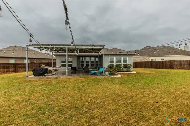 a view of a house with swimming pool and porch with furniture