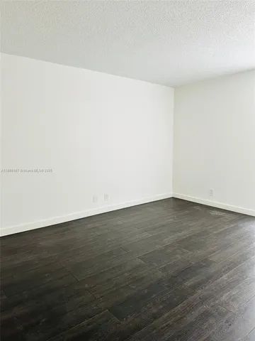an empty room with wooden floor
