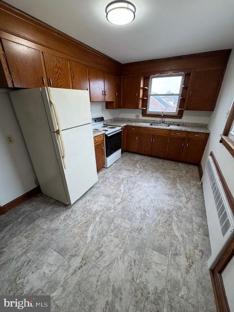 232 Bryan Place Hagerstown, MD 21740 - Photo 2 of 11 a kitchen with refrigerator and cabinets