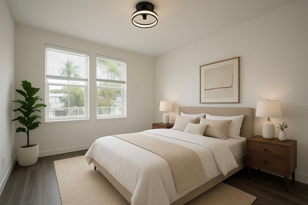 1659 2nd Street Sarasota, FL 34236 - Photo 5 of 24 a bedroom with a bed and a potted plant
