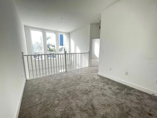 a view of staircase with rug floor