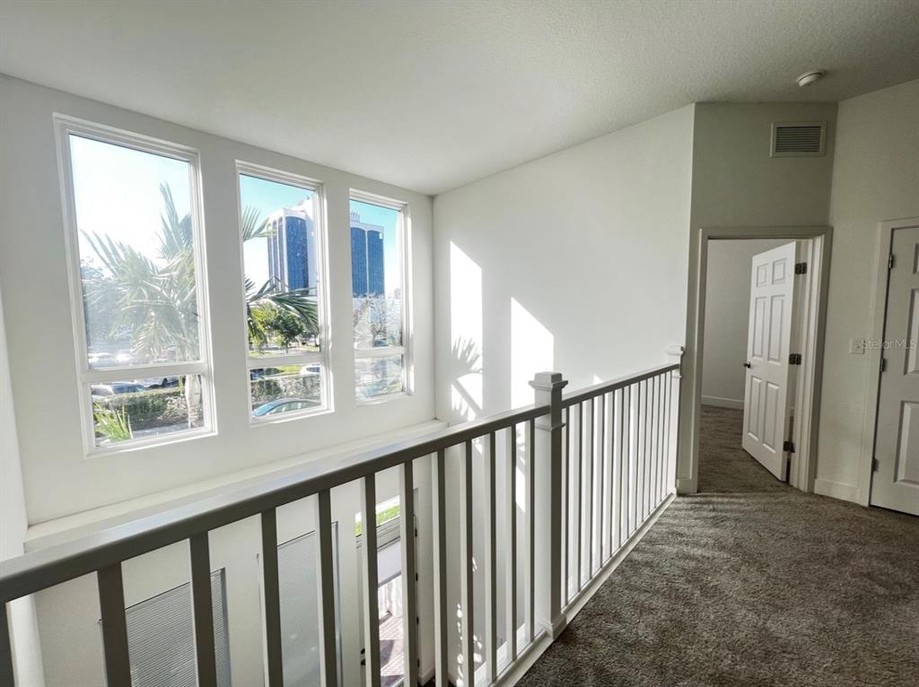 1659 2nd Street Sarasota, FL 34236 - Photo 9 of 24 a view of staircase with rug floor