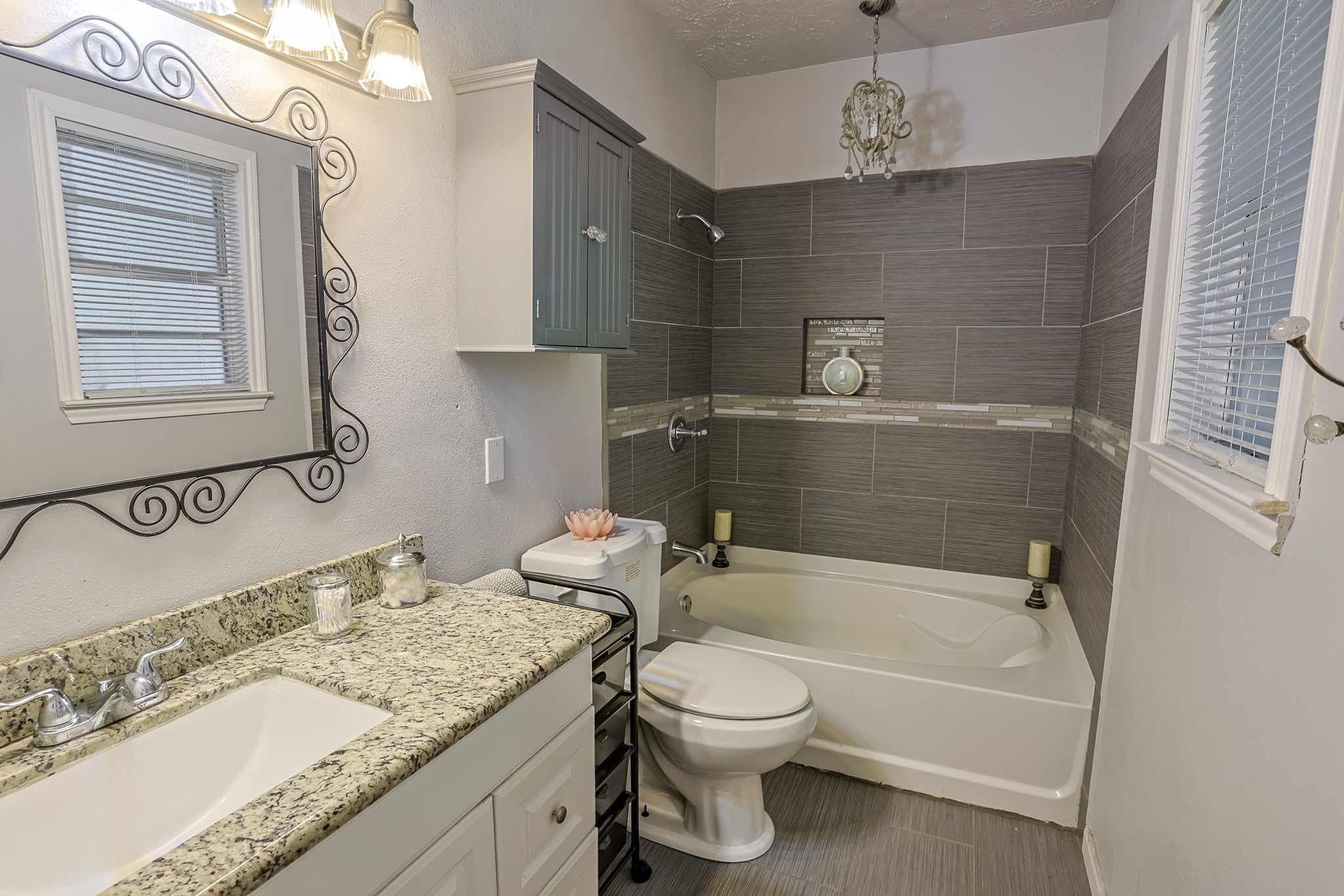 776 Fair Street Houston, TX 77088 - Photo 11 of 14 a bathroom with a granite countertop bathtub sink vanity mirror and toilet