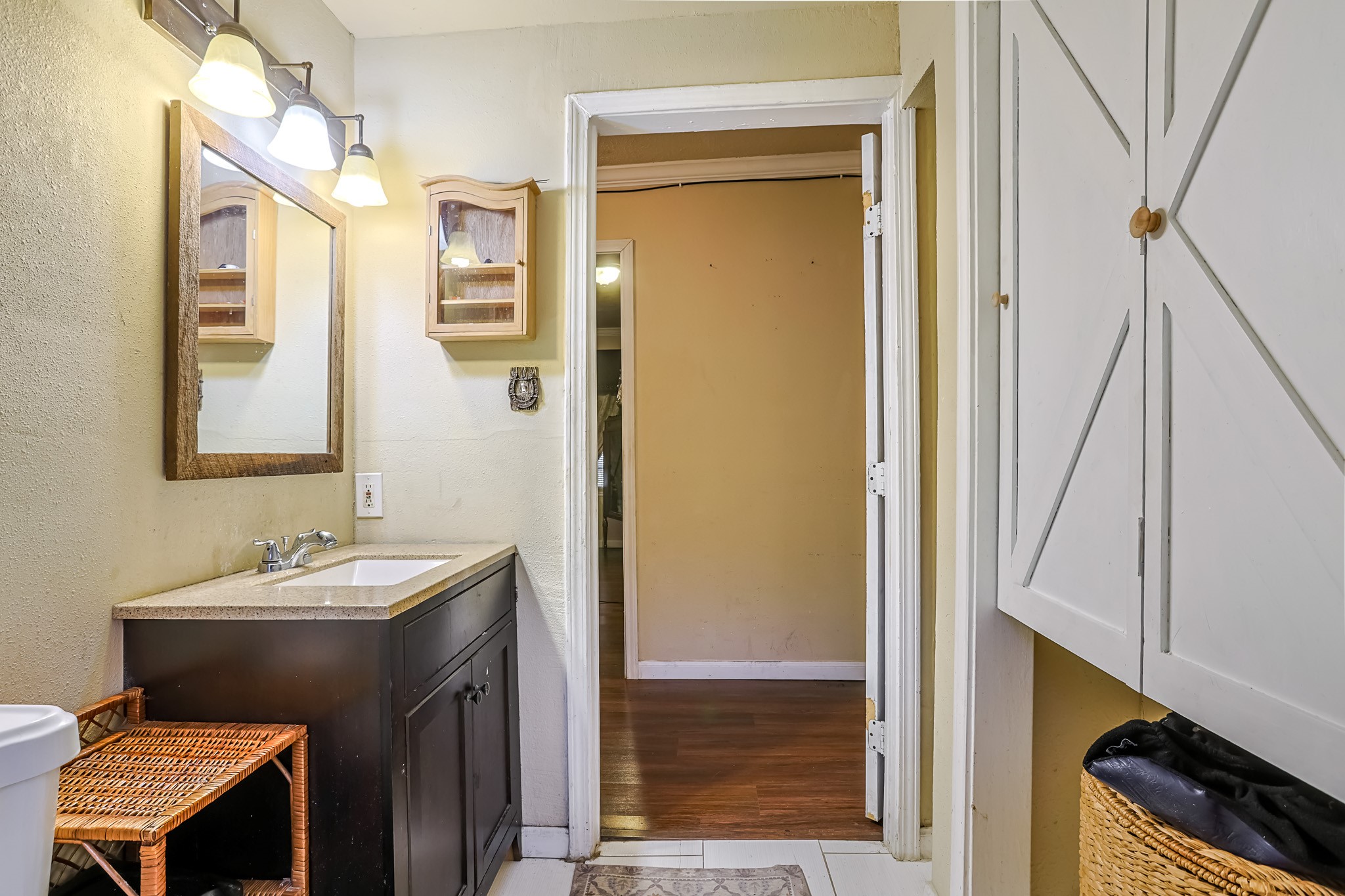 776 Fair Street Houston, TX 77088 - Photo 12 of 14 a bathroom with a sink a toilet and a mirror