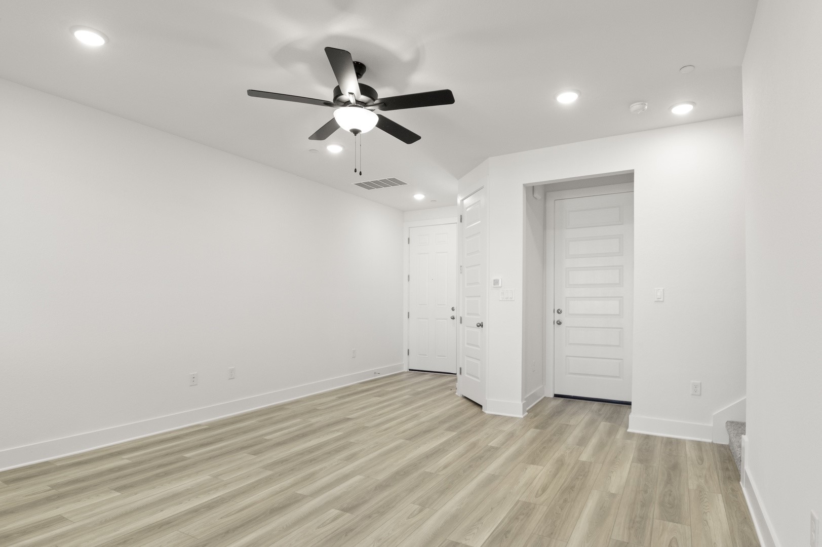 18909 Schultz Lane, Unit 1002 Round Rock, TX 78664 - Photo 7 of 24 Unfurnished bedroom featuring light wood-style flooring, recessed lighting, and a ceiling fan