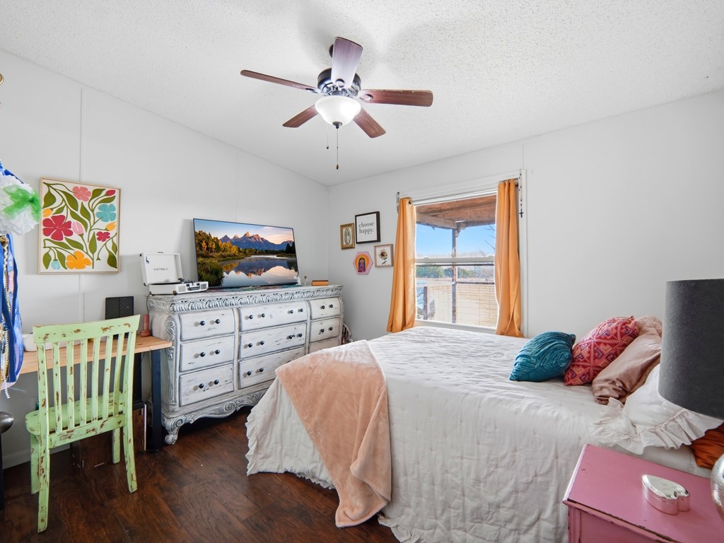 127 Windmill Drive Bandera, TX 78003 - Photo 16 of 29 a bedroom with a bed and furniture