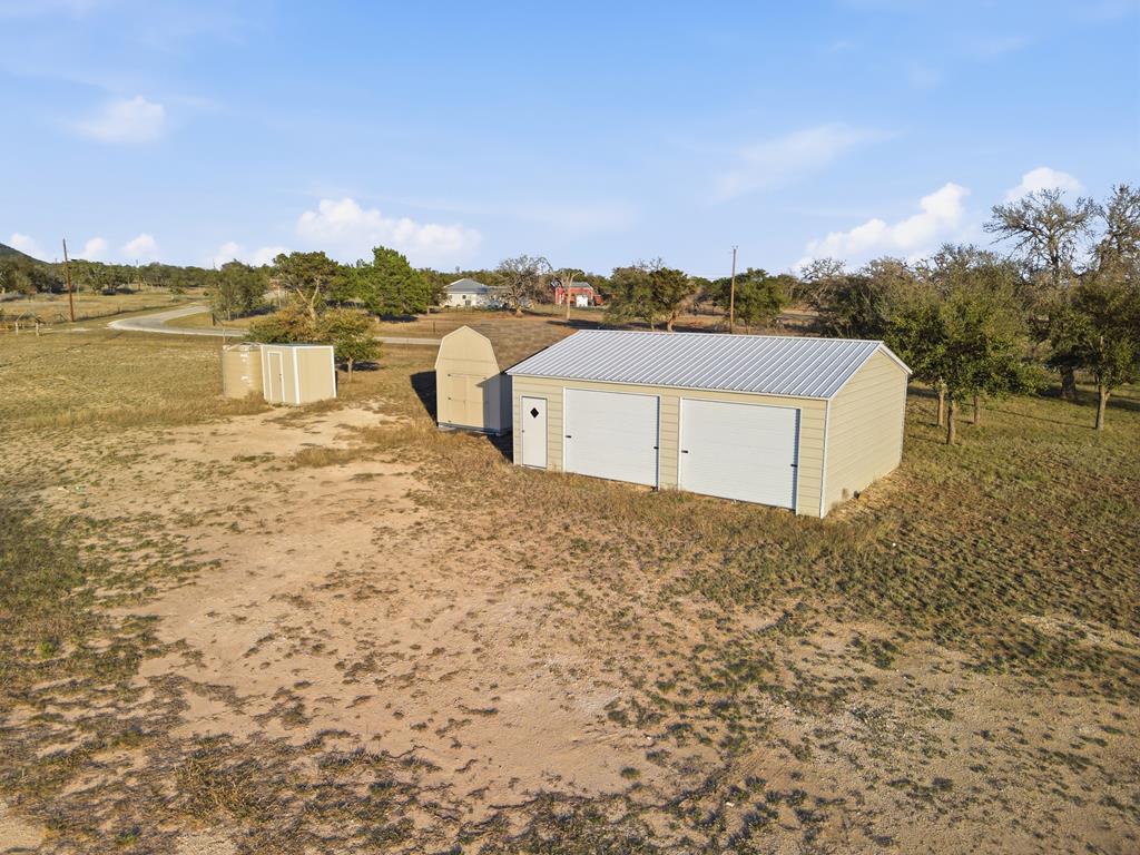 127 Windmill Drive Bandera, TX 78003 - Photo 24 of 29 a view of a lake with houses in the back