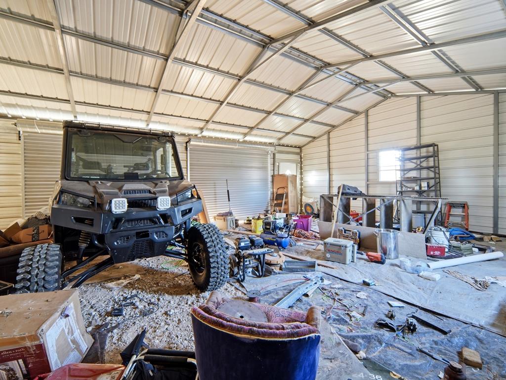 127 Windmill Drive Bandera, TX 78003 - Photo 26 of 29 a room with furniture and a flat screen tv