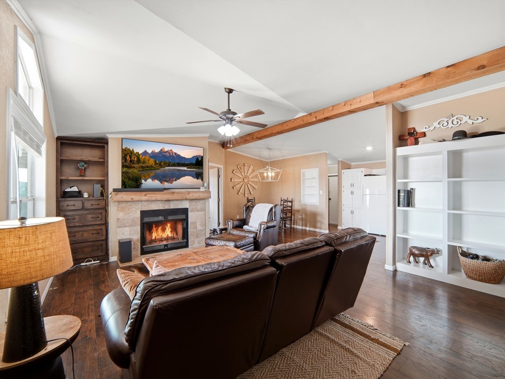 127 Windmill Drive Bandera, TX 78003 - Photo 8 of 29 a living room with furniture and a fireplace