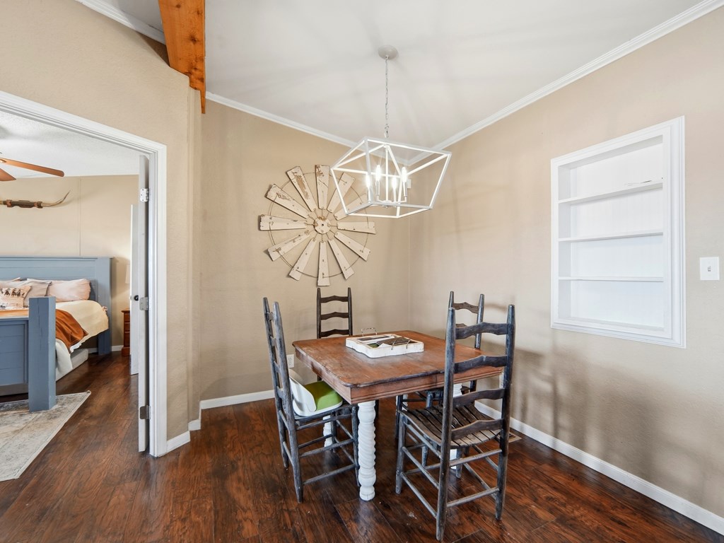 127 Windmill Drive Bandera, TX 78003 - Photo 10 of 29 a view of a dining room with furniture and wooden floor