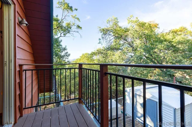 a bathroom with a granite countertop shower sink and mirror