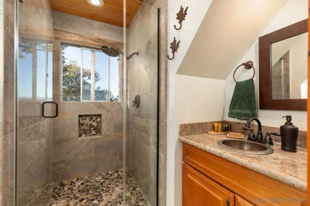 a bedroom with a bed and balcony view