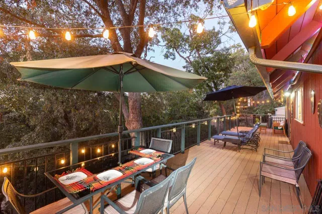a view of a chairs and table in the patio