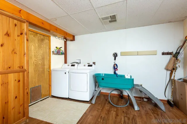 a view of a deck with wooden floor and outdoor seating