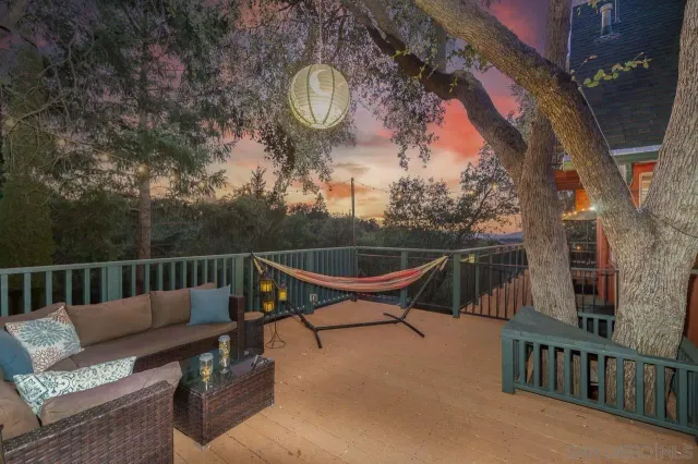 a view of brick house with large windows