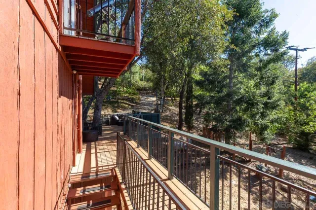 a view of a house with backyard porch and sitting area