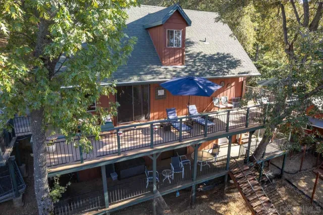 a view of house with outdoor seating