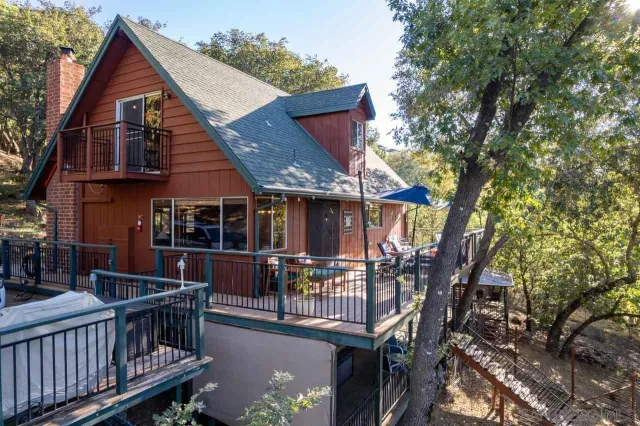an aerial view of a house with a outdoor space