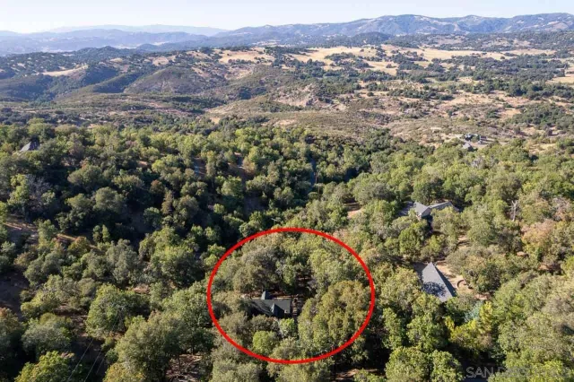 a view of a houses with a mountain in the background