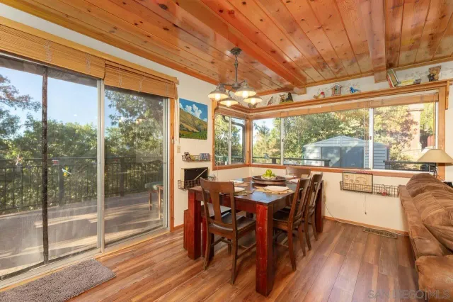 a kitchen with stainless steel appliances granite countertop lots of counter top space and wooden floor