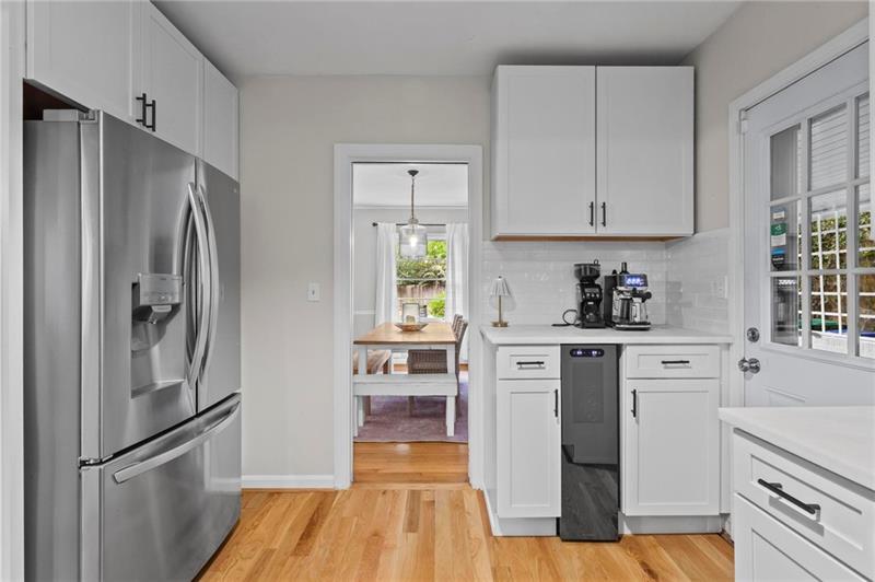 2333 Ferndale Drive Decatur, GA 30030 - Photo 15 of 30 a kitchen with white cabinets and stainless steel appliances
