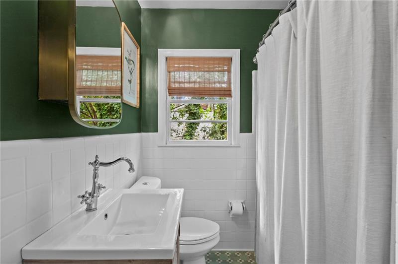 2333 Ferndale Drive Decatur, GA 30030 - Photo 18 of 30 a bathroom with a sink a toilet and a window