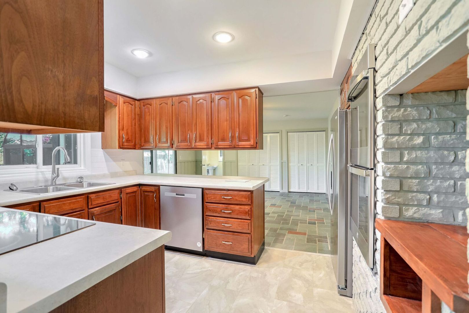 1716 Georgetown Drive Champaign, IL 61821 - Photo 12 of 36 a kitchen with wooden cabinets and a sink
