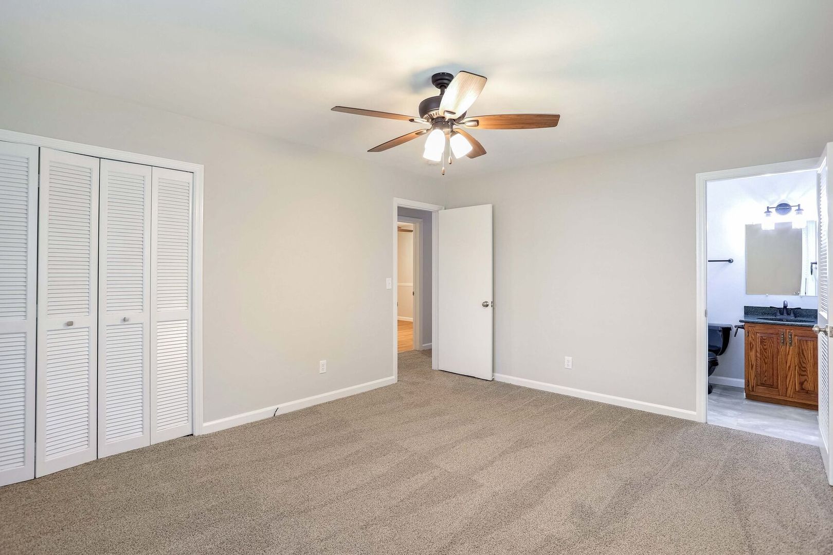 1716 Georgetown Drive Champaign, IL 61821 - Photo 19 of 36 a view of an empty room with a chandelier fan