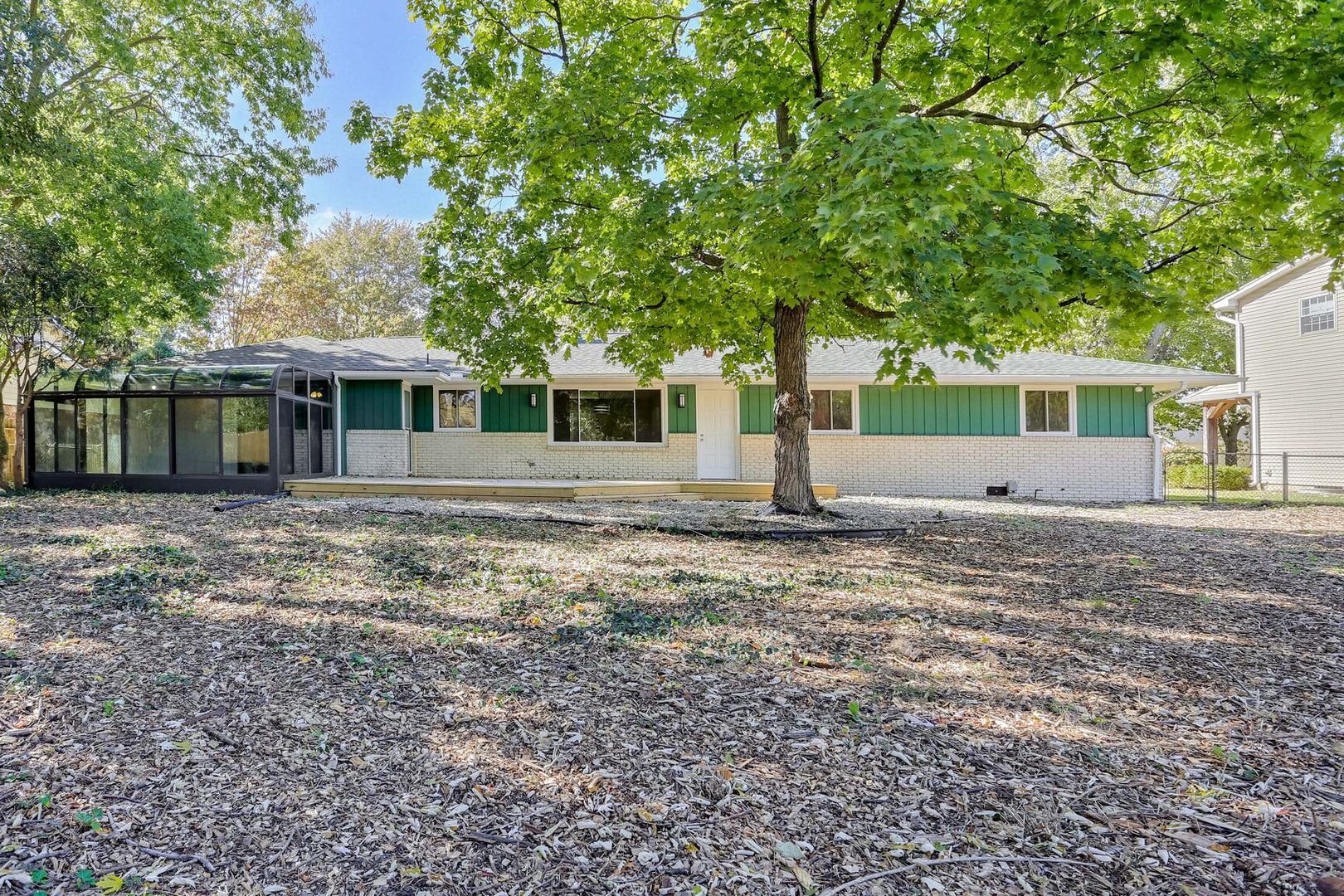 1716 Georgetown Drive Champaign, IL 61821 - Photo 33 of 36 a front view of a house with a garden