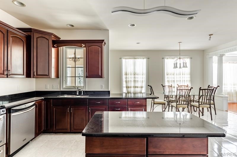 5061 Rockhaven Drive Clarence, NY 14031 - Photo 13 of 48 lKitchen view to back of the house