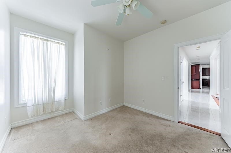 5061 Rockhaven Drive Clarence, NY 14031 - Photo 19 of 48 Back den, easily converted to gracious laundry roo