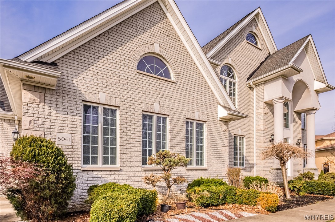5061 Rockhaven Drive Clarence, NY 14031 - Photo 39 of 48 Front garden and yard features sprinkler system