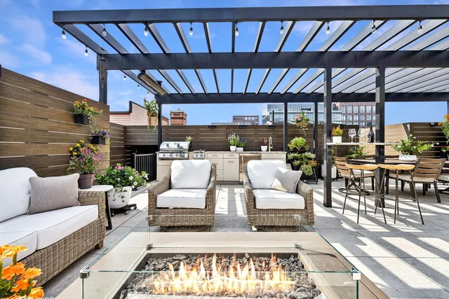 a view of patio with chairs and potted plants