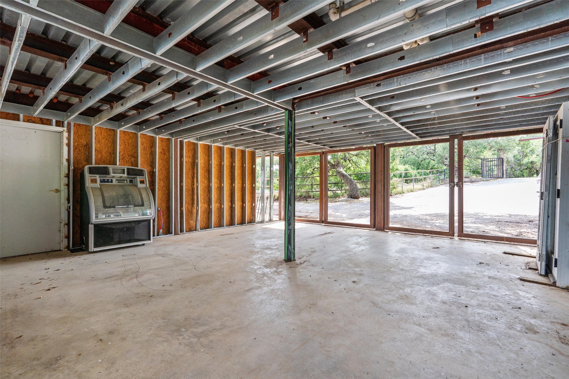 325 Eagle Rest Burnet, TX 78611 - Photo 31 of 40 Concrete floors and exposed structural elements create a raw, industrial aesthetic with abundant outdoor access.
