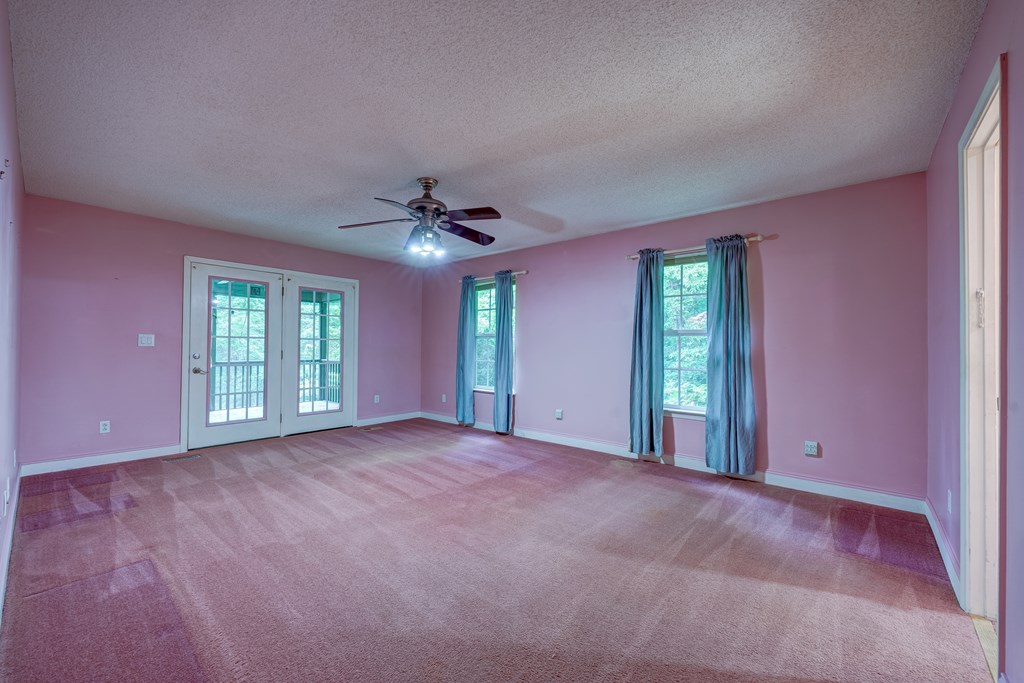 9327 Highway 52 Chatsworth, GA 30705 - Photo 14 of 43 a view of a livingroom with a ceiling fan and window