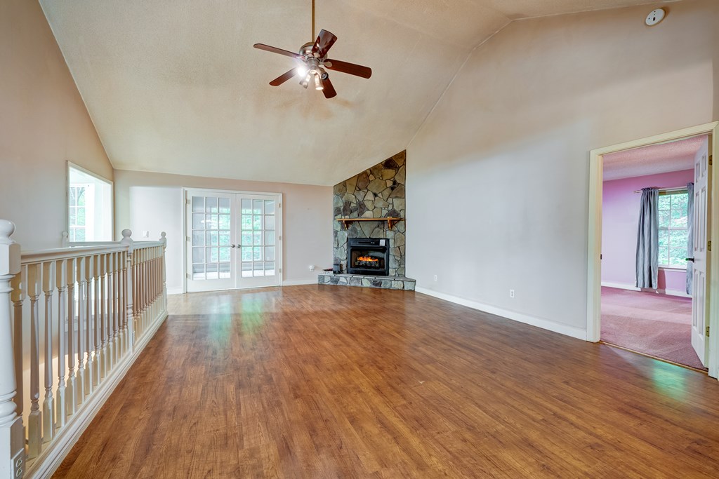 9327 Highway 52 Chatsworth, GA 30705 - Photo 9 of 43 wooden floor in an empty room with a window
