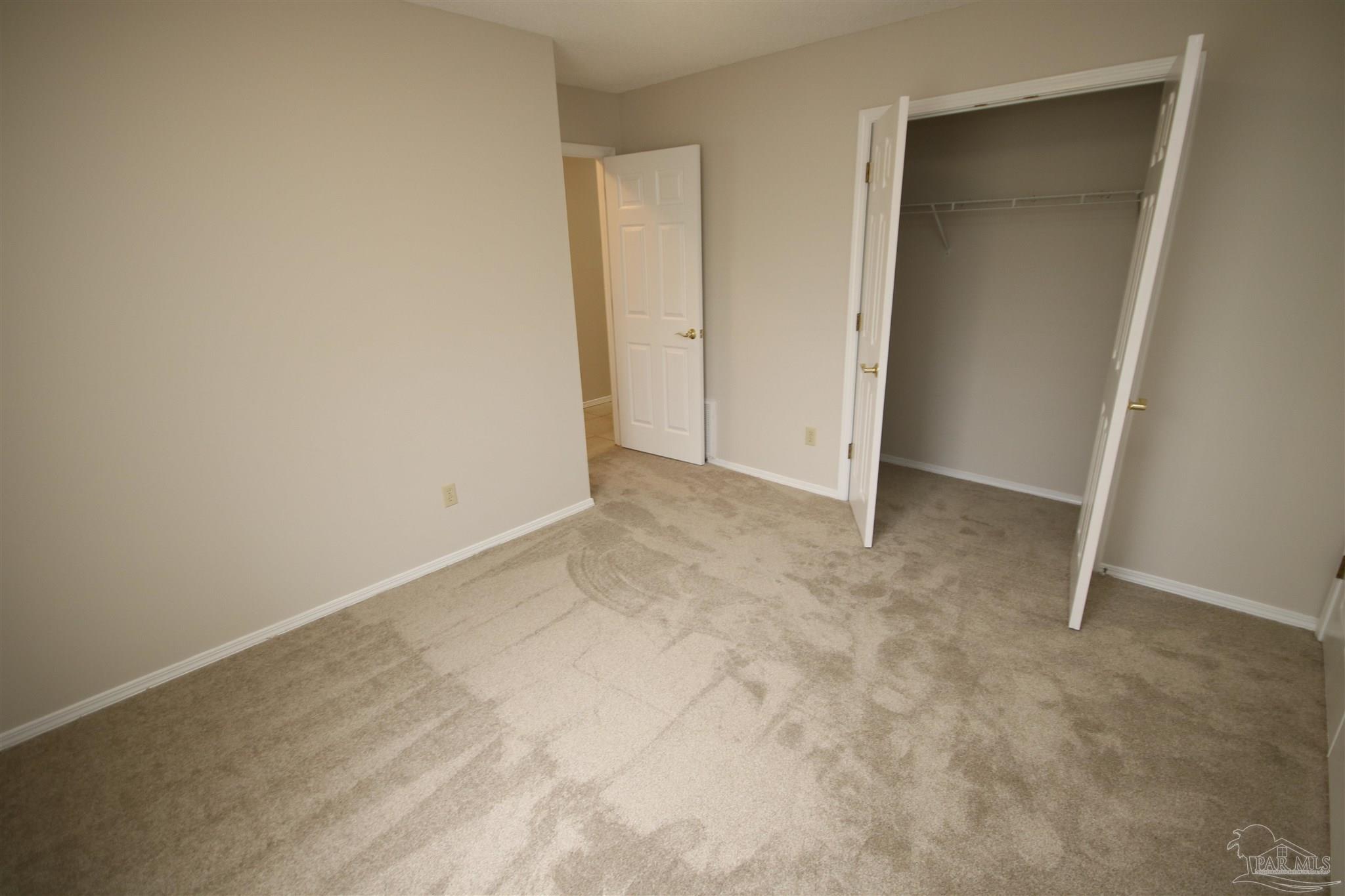 4959 Pattock Place Pace, FL 32571 - Photo 22 of 50 Large closet with double doors to the right.