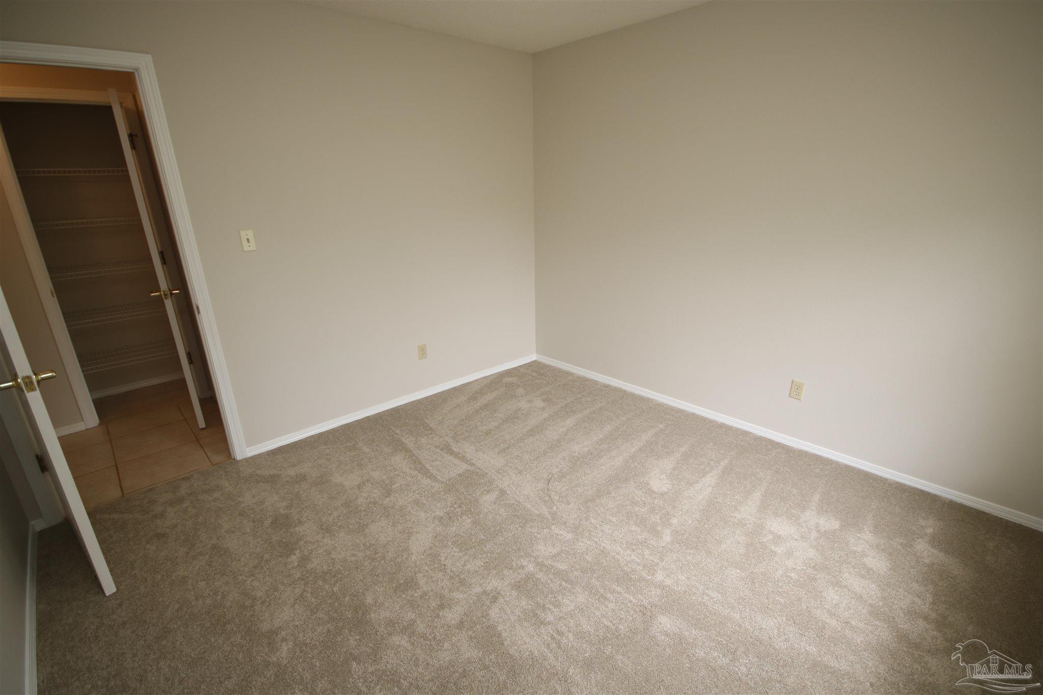 4959 Pattock Place Pace, FL 32571 - Photo 35 of 50 closet in hallway. Laundry room to the right.