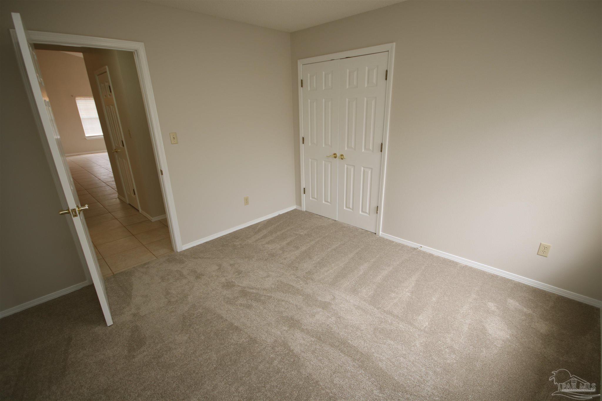 4959 Pattock Place Pace, FL 32571 - Photo 39 of 50 through door on your left.