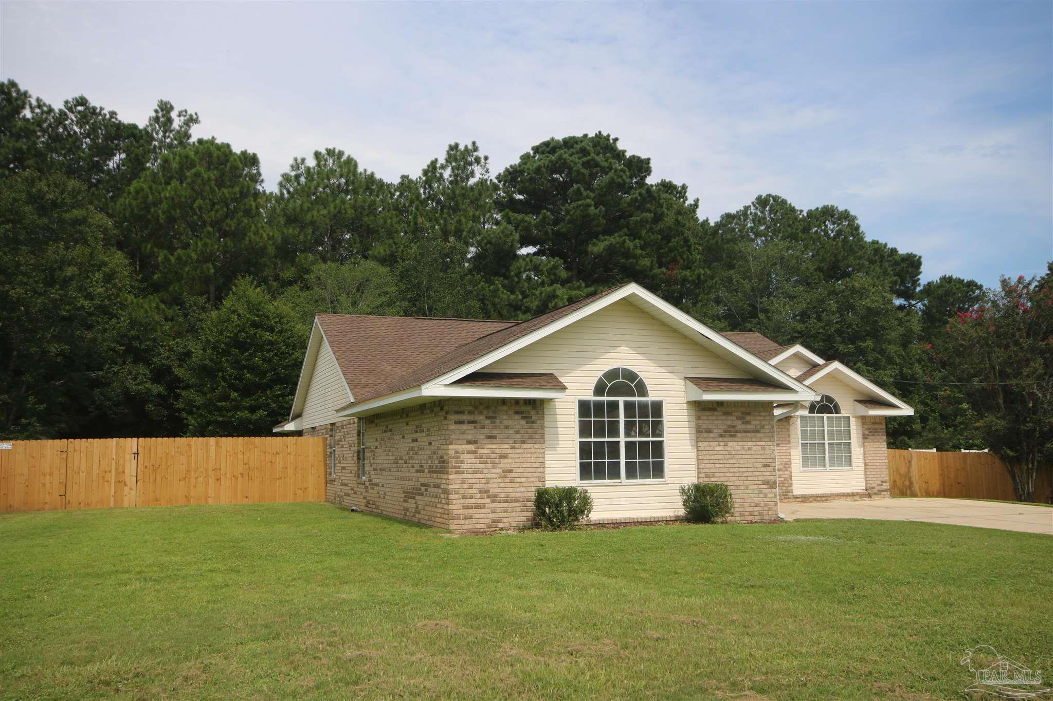 4959 Pattock Place Pace, FL 32571 - Photo 6 of 50 outside the fence.Drainfield lines run to front yd