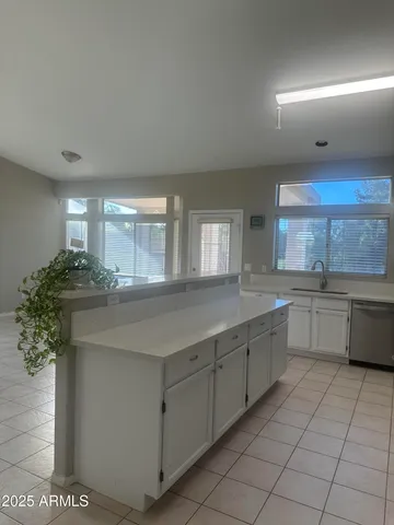 a bathroom with a sink a bathtub and window