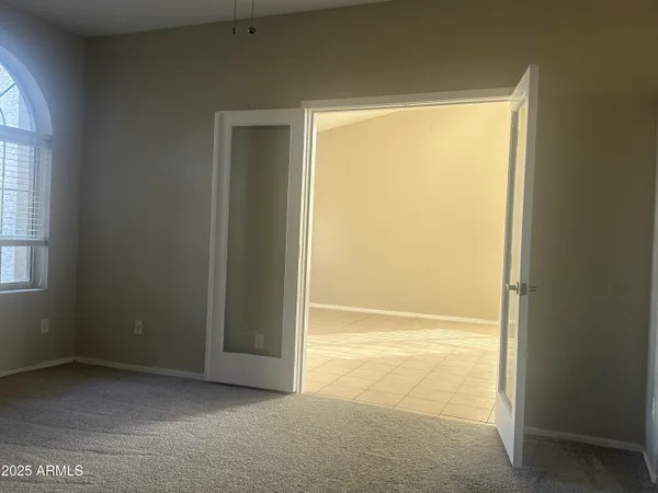 a view of an empty room with a window