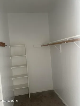a view of an empty walk in closet