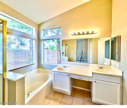 a room with a bed and a large window