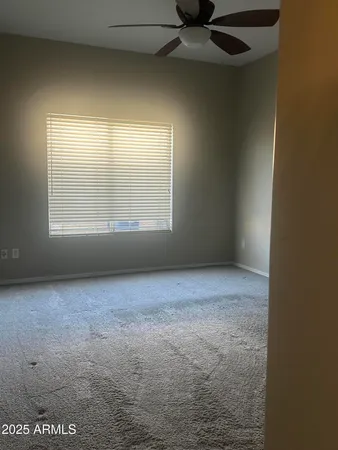 an empty room with a empty space and windows