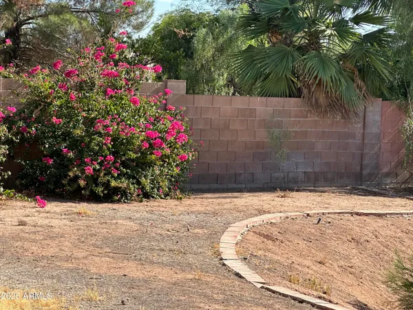 a view of flower garden in front of a house