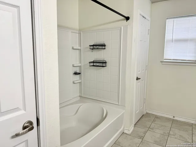 a backyard of a house with barbeque oven