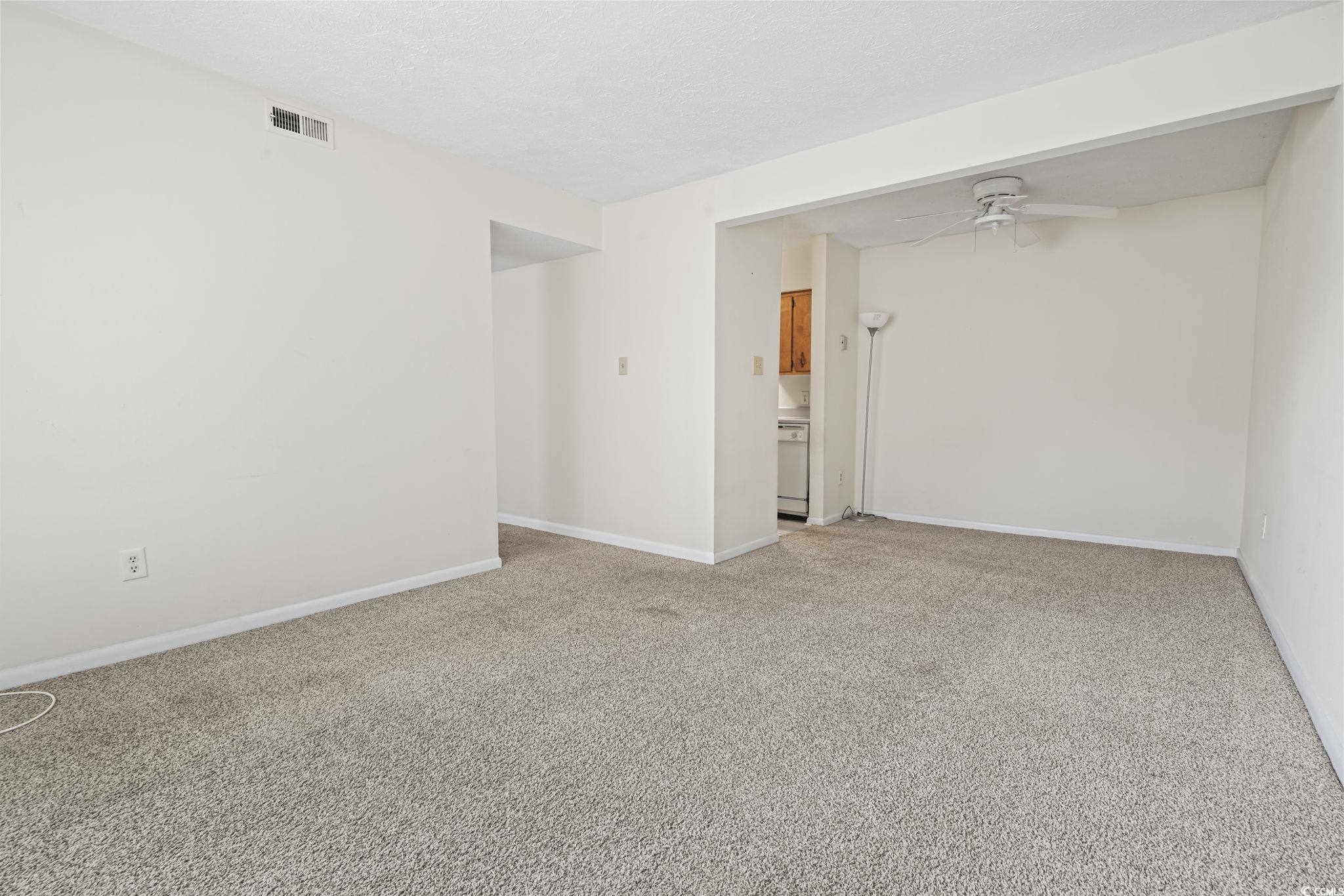 615 Carter Lane, Unit A1 Conway, SC 29526 - Photo 14 of 31 Empty room featuring light colored carpet, ceiling fan, and a textured ceiling