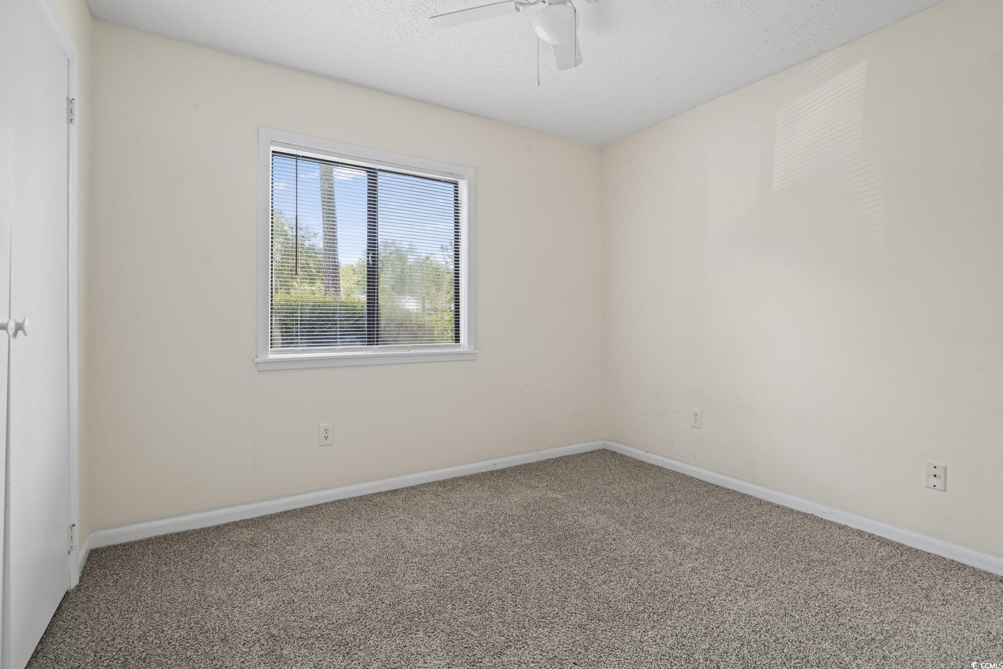 615 Carter Lane, Unit A1 Conway, SC 29526 - Photo 20 of 31 Carpeted empty room featuring a textured ceiling and ceiling fan