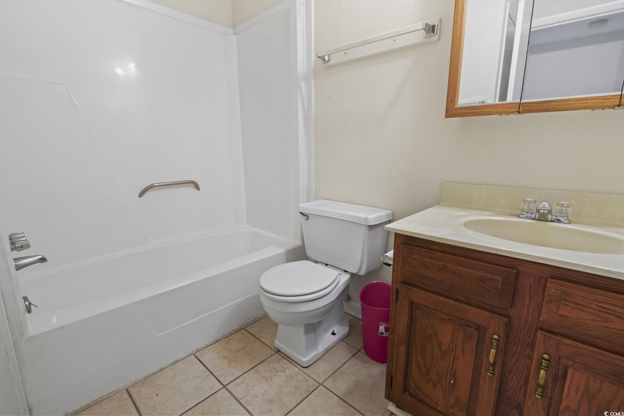 615 Carter Lane, Unit A1 Conway, SC 29526 - Photo 22 of 31 Bathroom with vanity, shower combination, and light tile patterned flooring